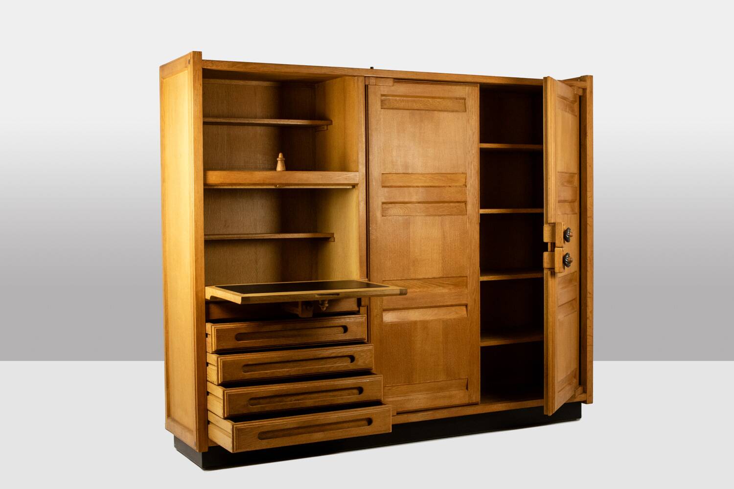 Guillerme and Chambron. Oak wardrobe with integrated secretary. 1970-80.