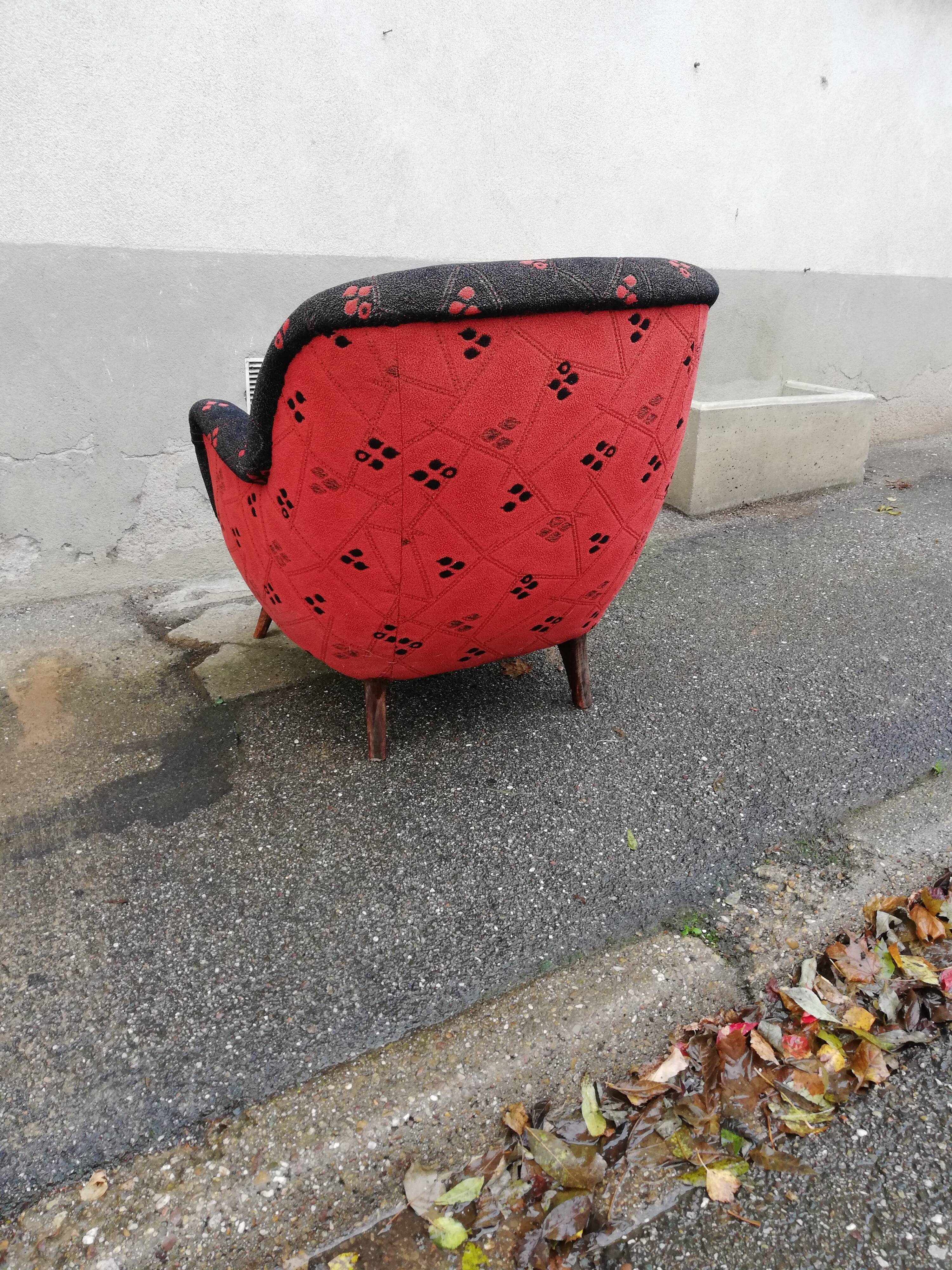 Fauteuil année 50 rouge et noir pieds compas