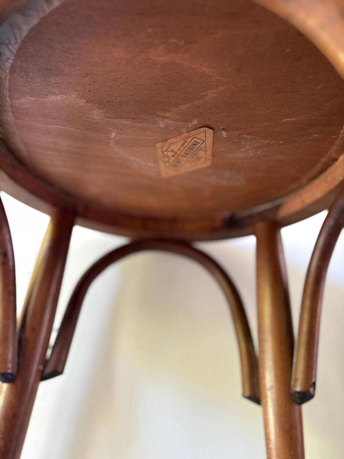 Thonet low stool in vintage wood