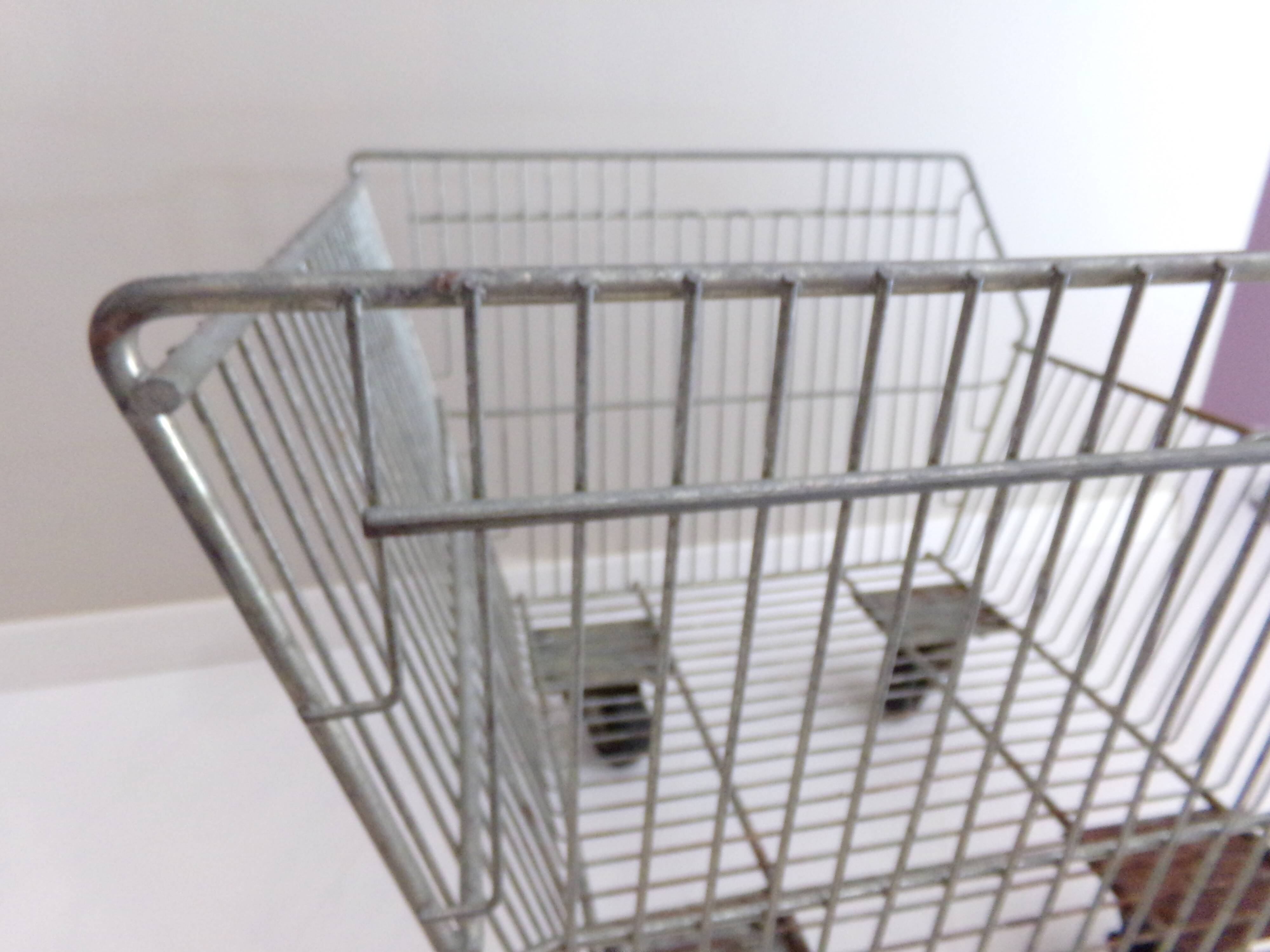 Metal grocery shelf on wheels