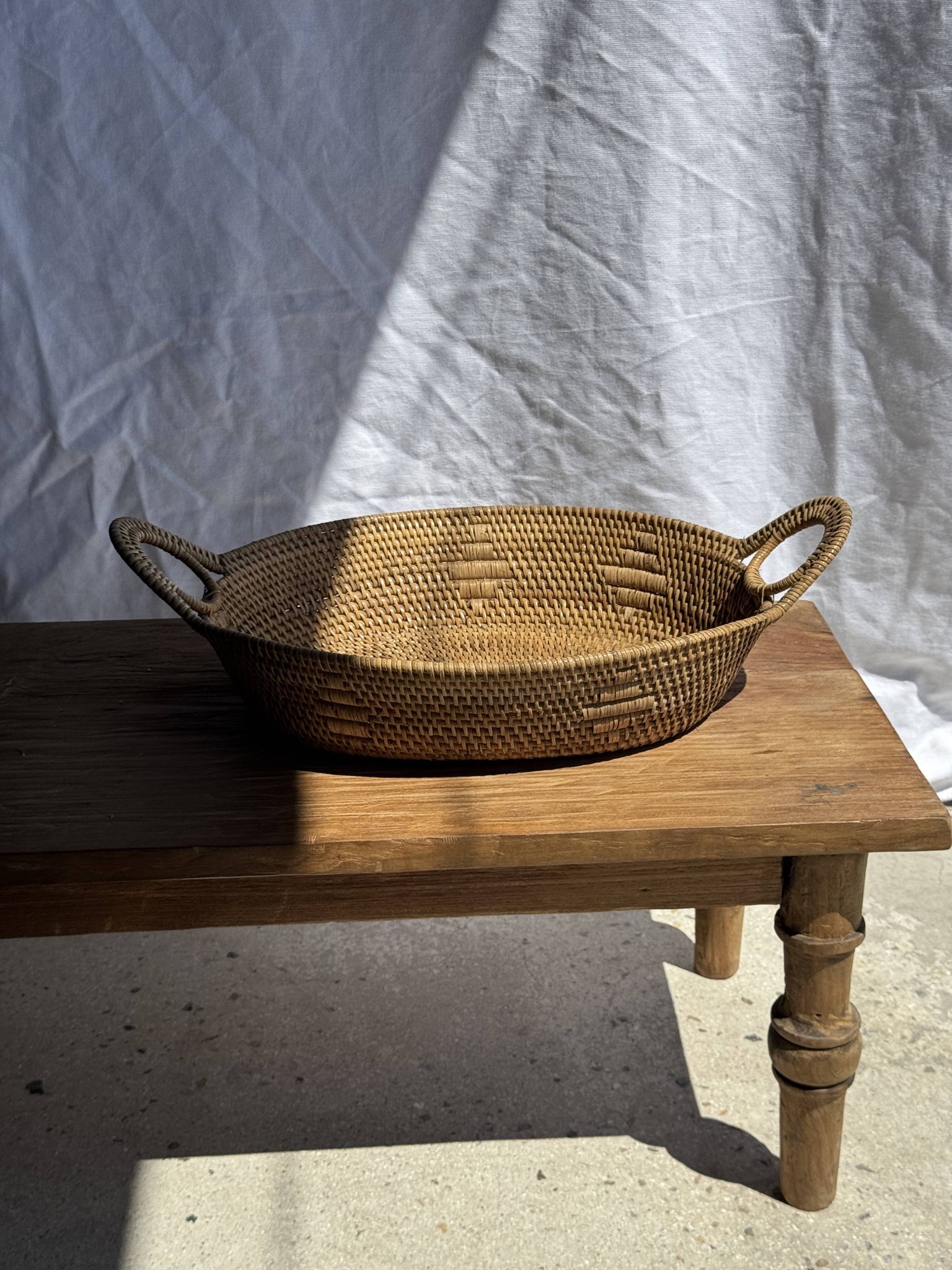 Large flat oval woven rattan basket with handles, Indonesian L53x64