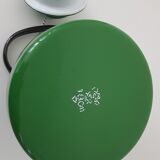 Old green kettle in enamelled metal