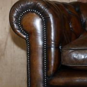 Restored leather Chesterfield sofa, walnut legs.