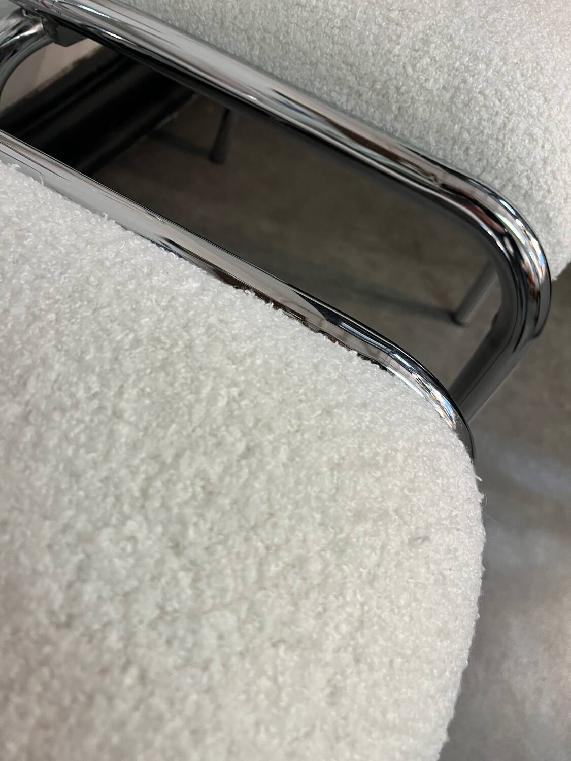 Pair of chrome chairs upholstered in boucle fabric.
