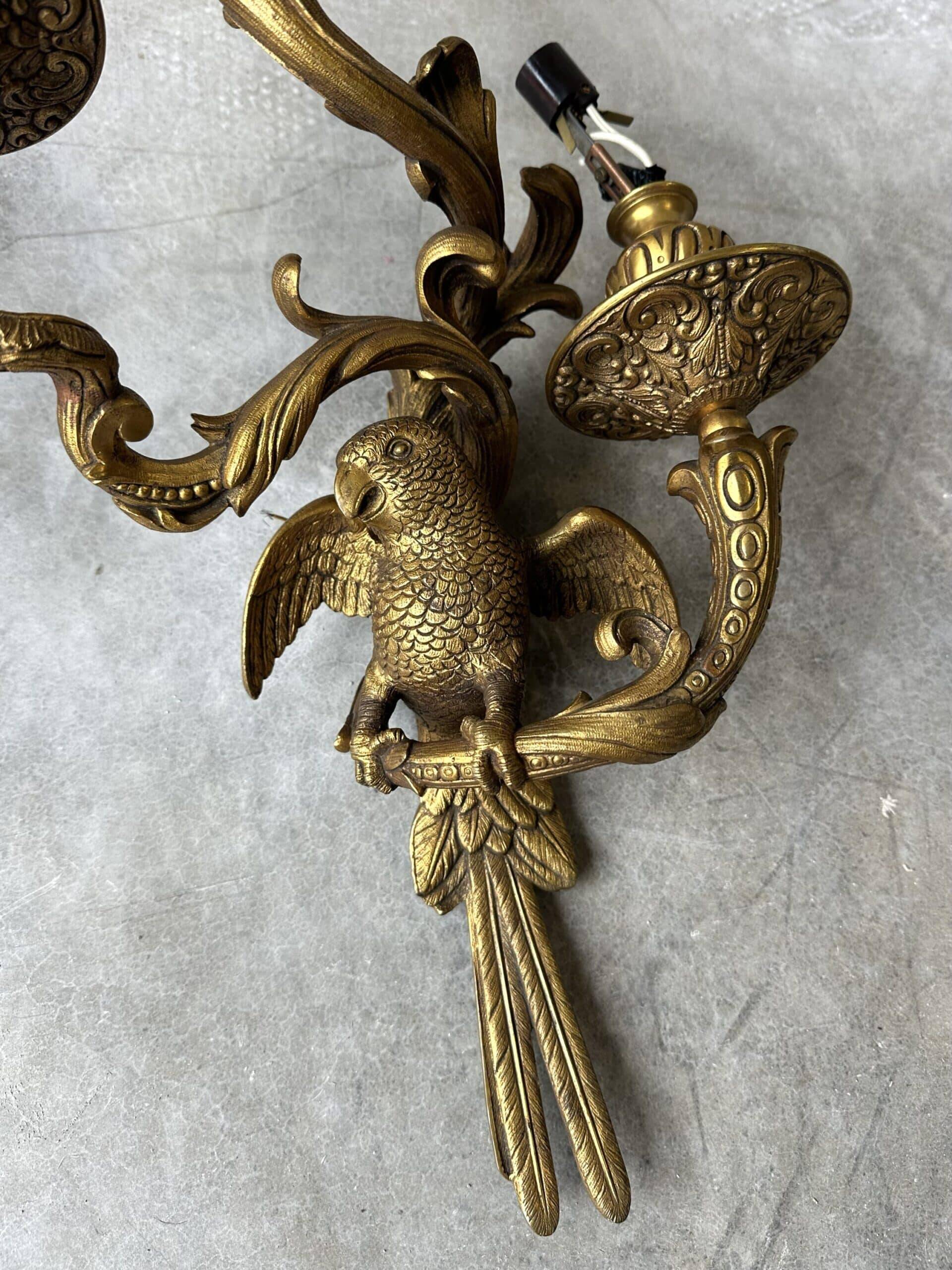 Pair of bronze wall sconces with parrots, early 20th century.