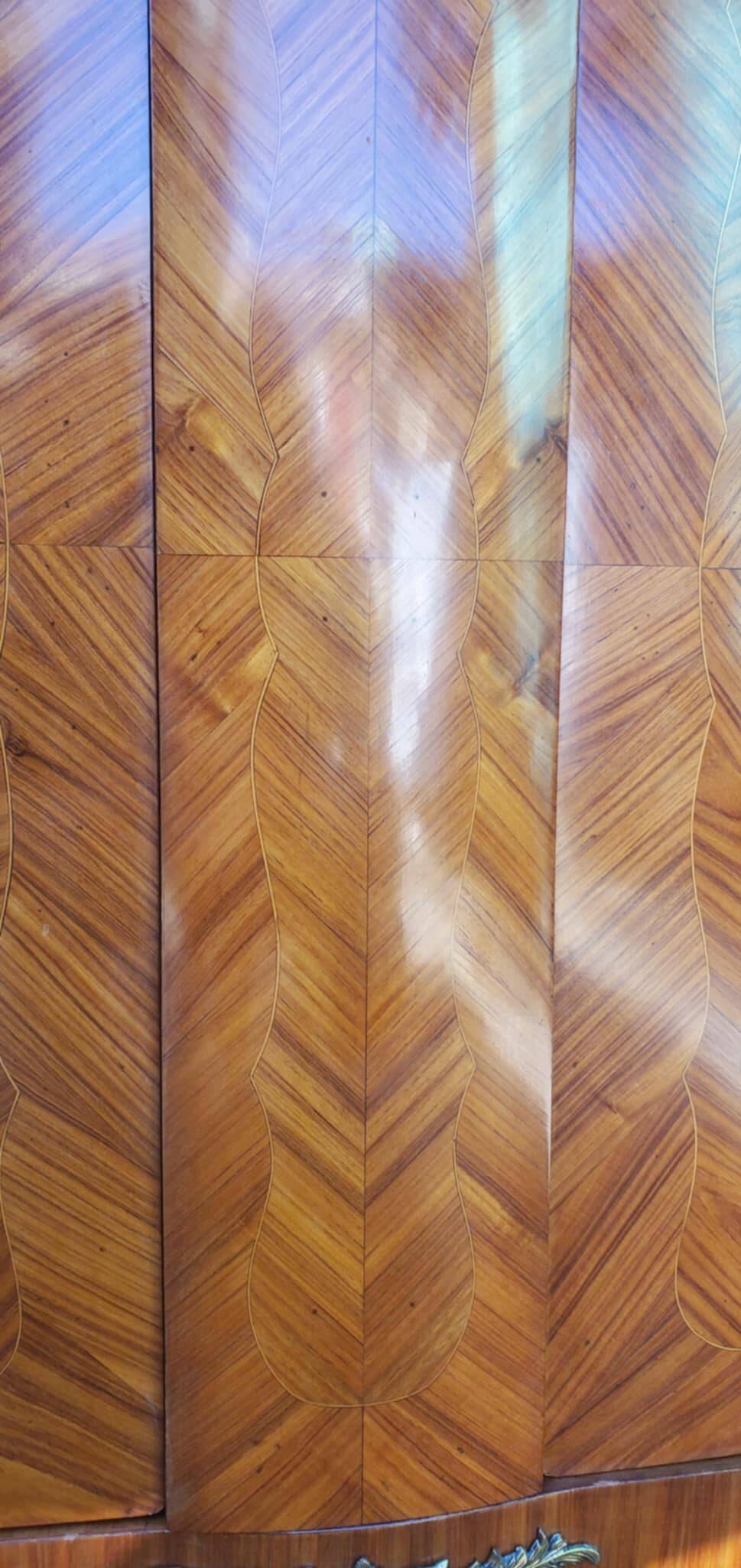 Two-door cabinet with marquetry floral design from the early 20th century.