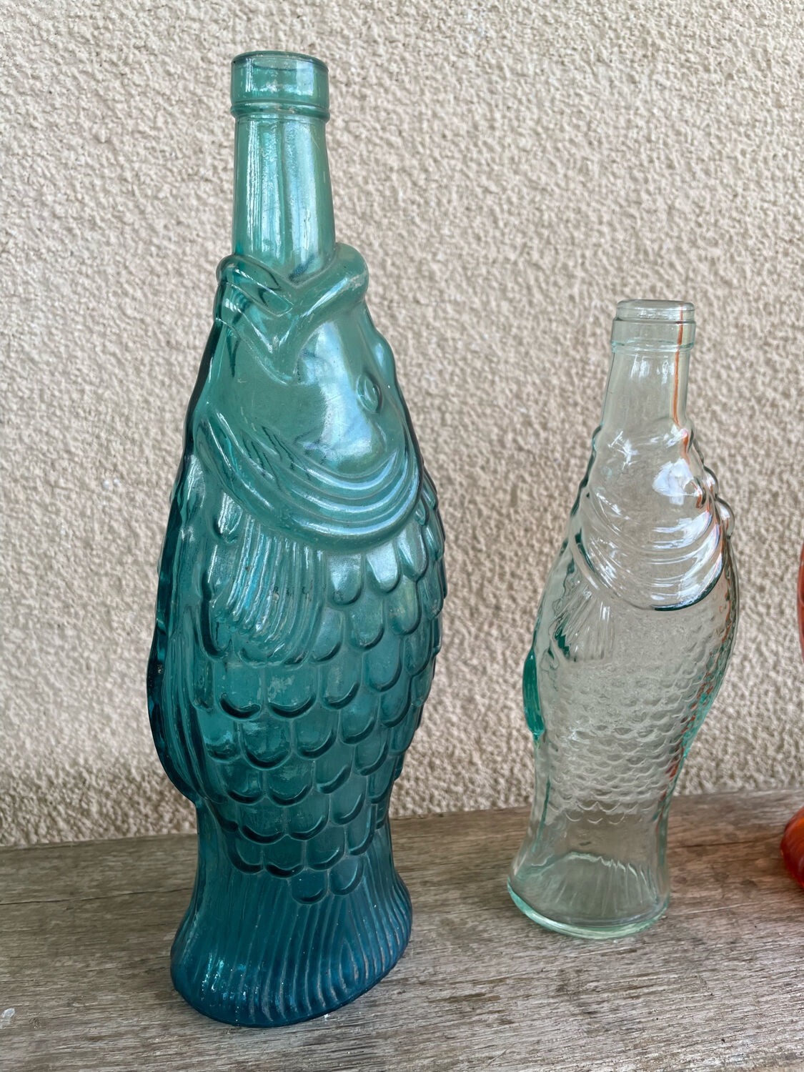 3 glass bottle fish
