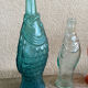 3 glass bottle fish