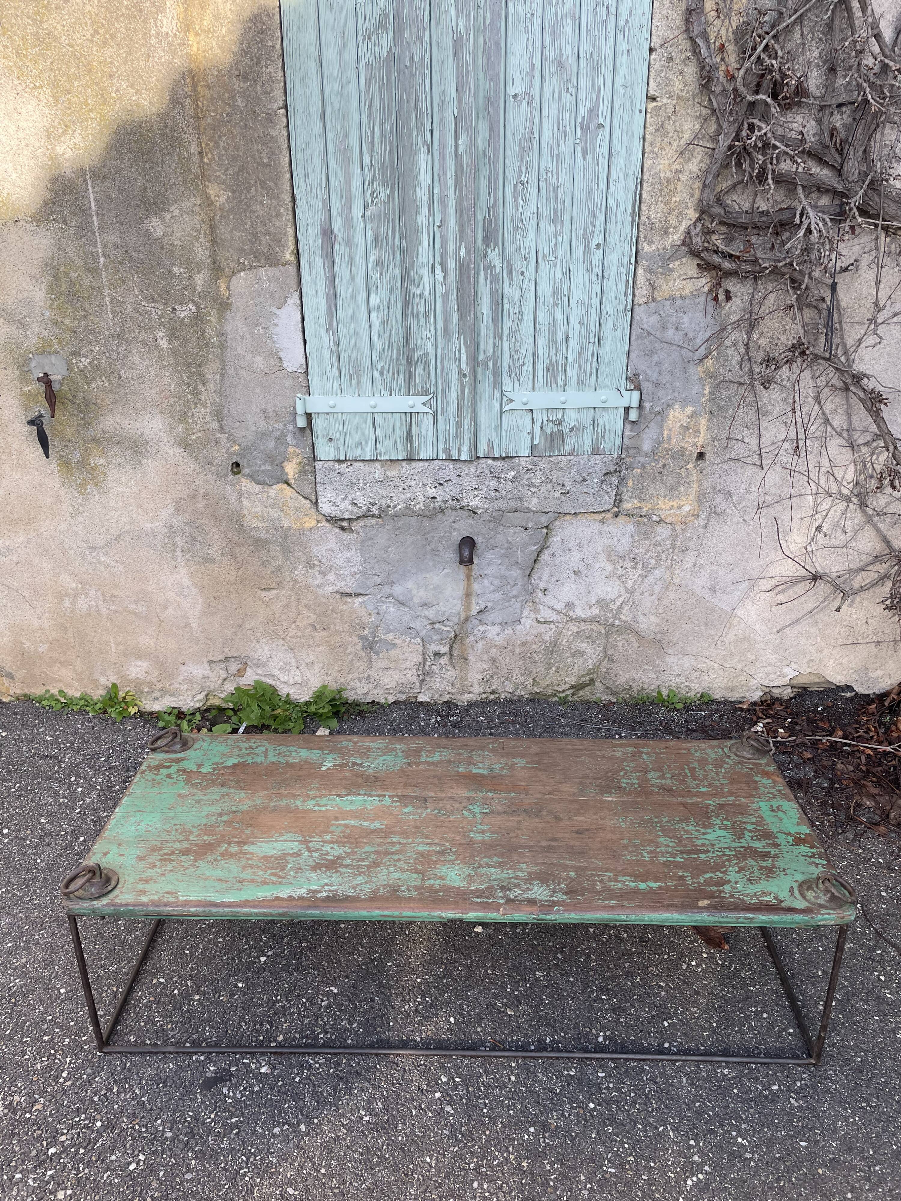 Pair of green teak coffee tables.
