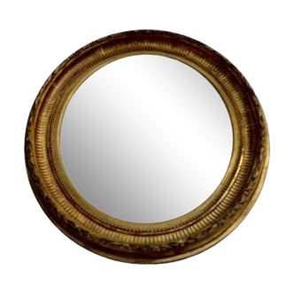 Oval wall mirror in gilded wood late nineteenth