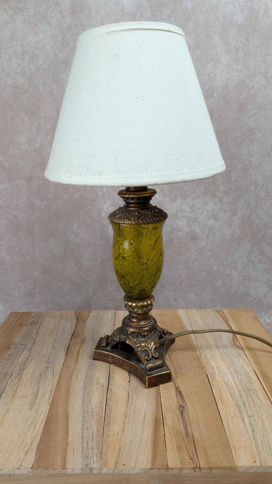 Vintage lamp with bronze imitation base & green relief glass in an antique style.