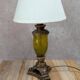 Vintage lamp with bronze imitation base & green relief glass in an antique style.