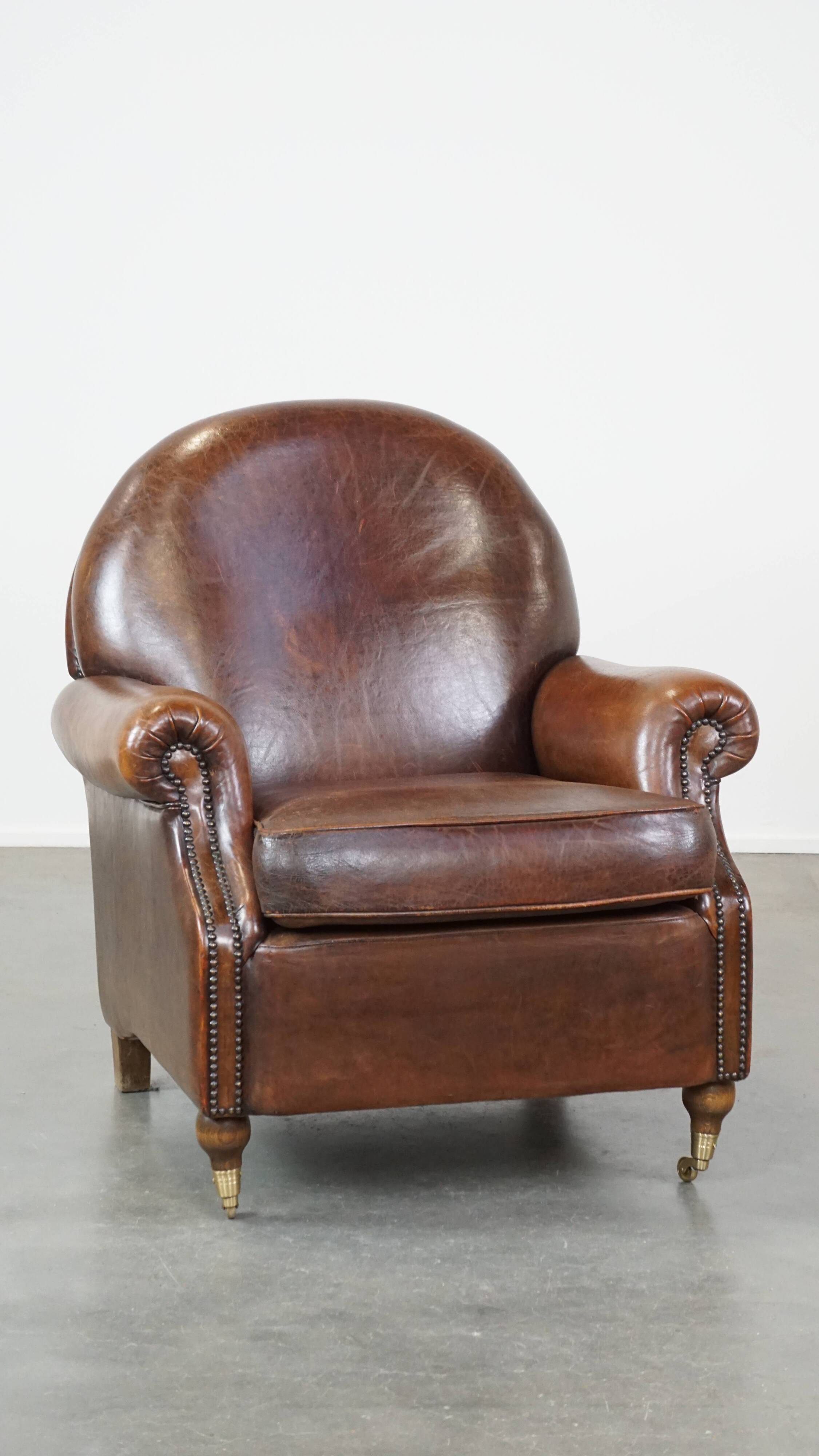 Sheep leather armchair on wheels