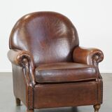 Sheep leather armchair on wheels