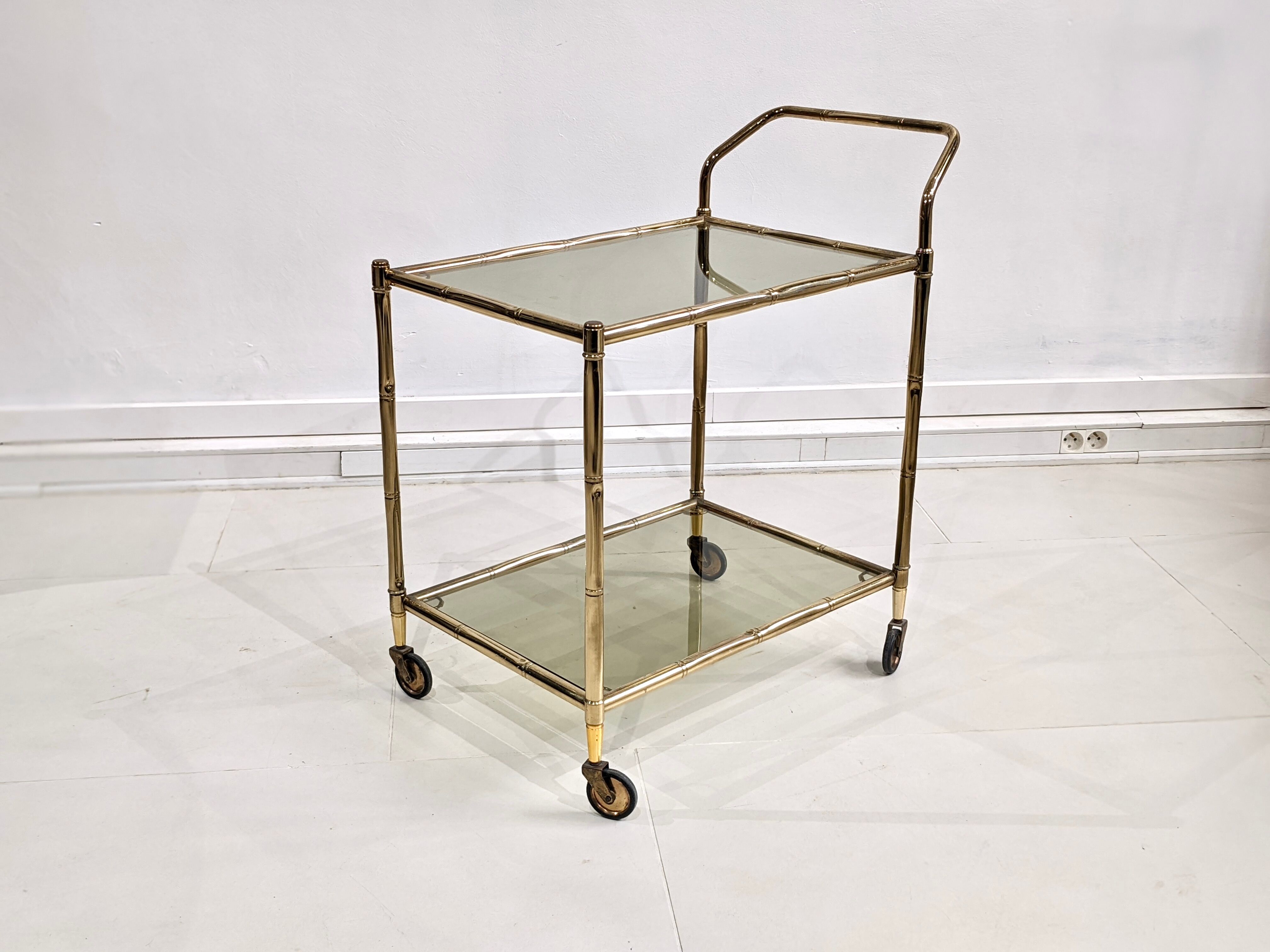 Golden metal dessert with tinted glass tops