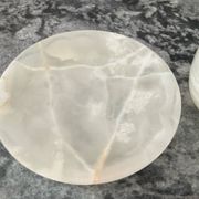 A pair of vintage onyx catchalls from the 1970s.