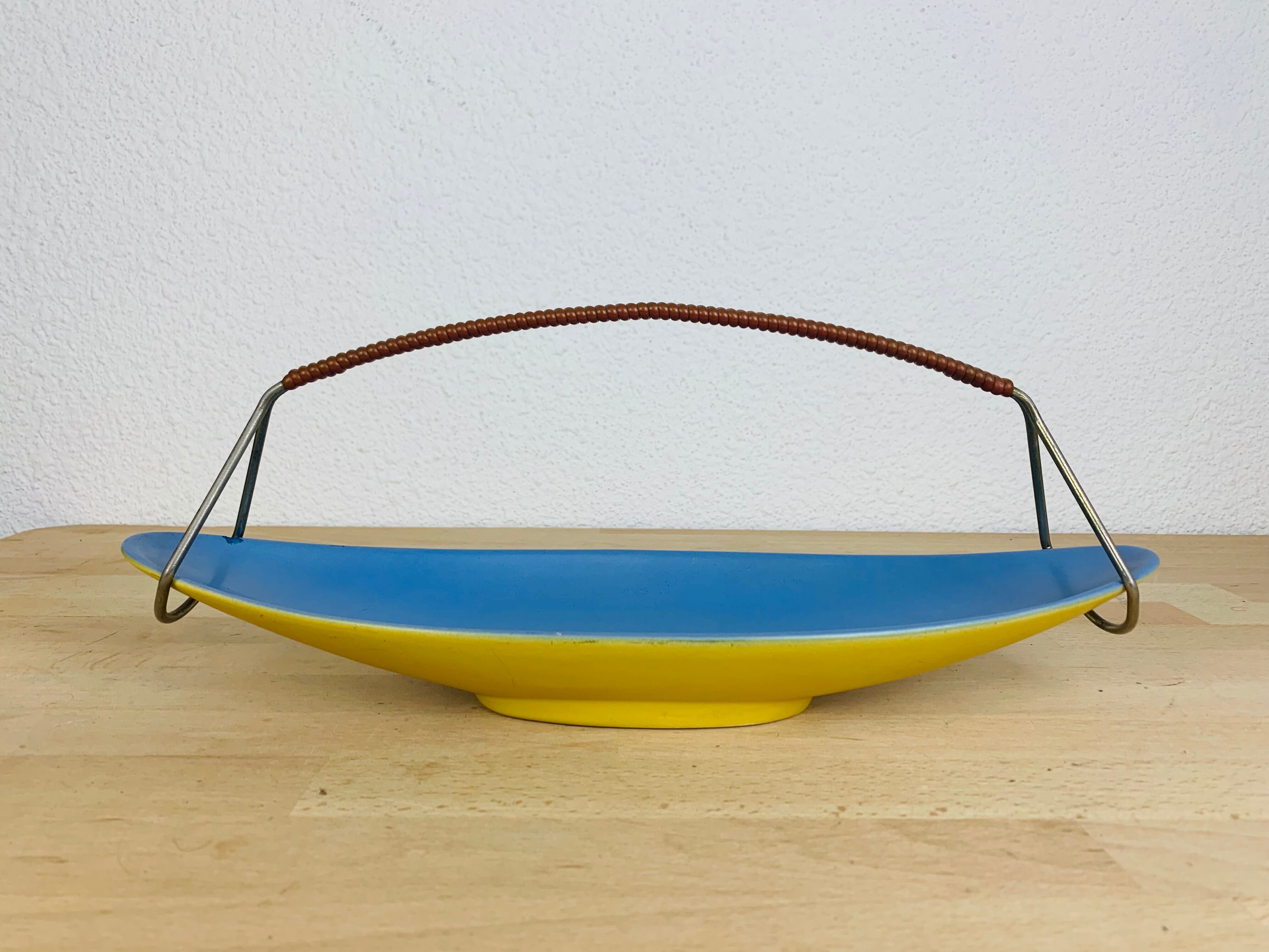 Empty ceramic shuttle pocket from the 50s