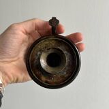 Small antique candle holder in patinated metal