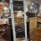 Beige patinated mirror with women's heads