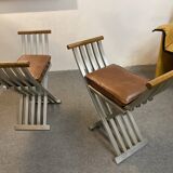 Pair of curule chairs designed by John Vesey, 1958, USA, brushed aluminum, walnut and leather