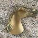 Vintage bronze horse pocket emptier