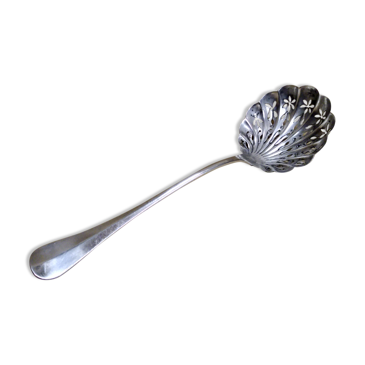 Service spoon cut out of silver metal
