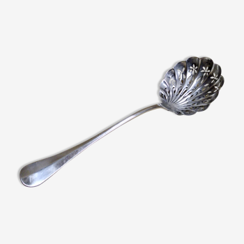 Service spoon cut out of silver metal