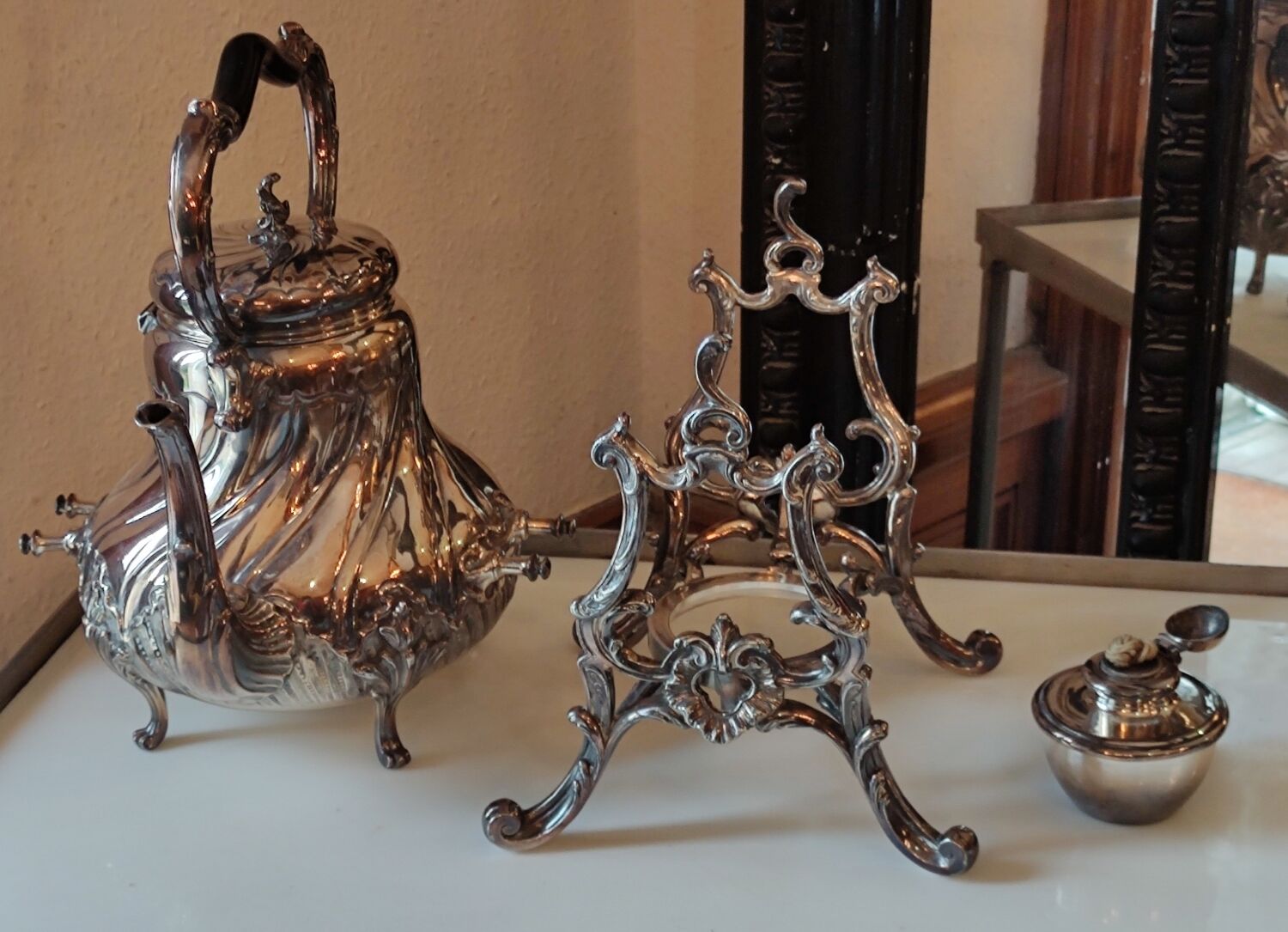 Ancient samovar tea fountain in silver metal