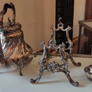 Ancient samovar tea fountain in silver metal