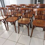 Suite of 12 chairs of bistrot Baumann 1940s