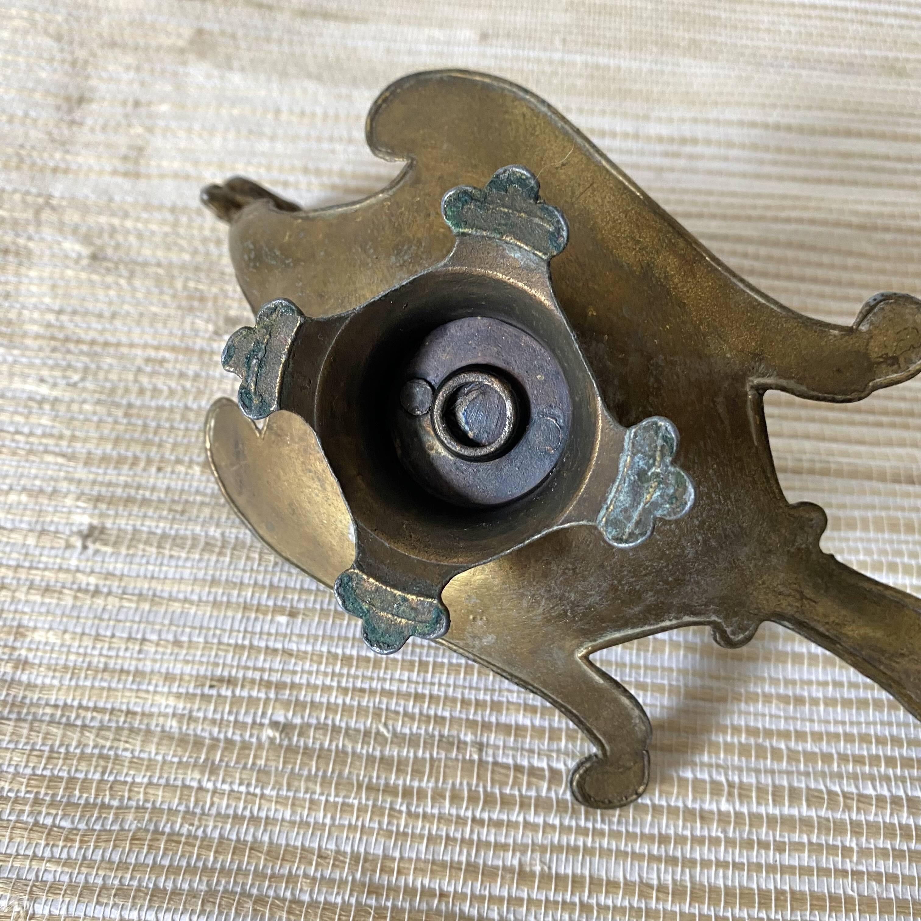 Brass bird candle holder