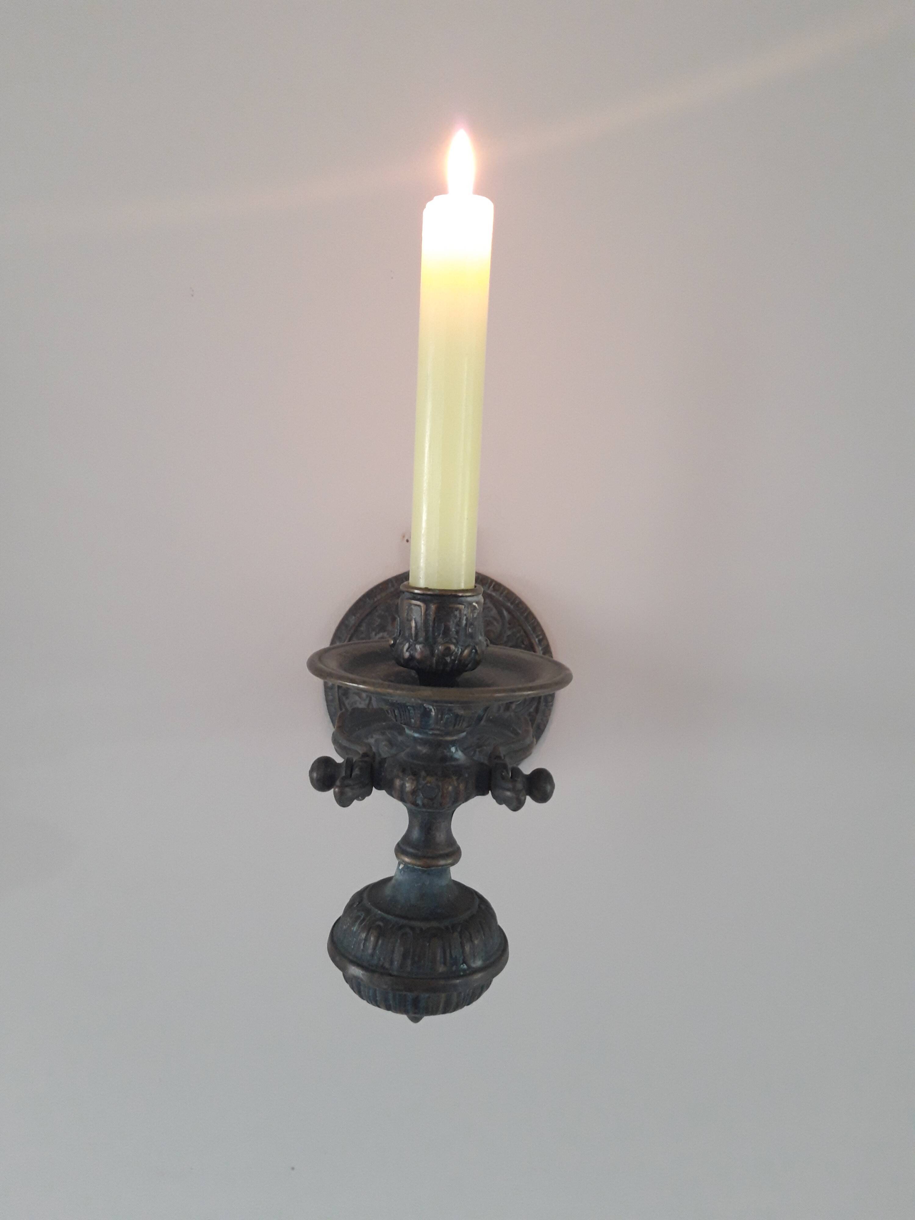 Bronze pendulum candle holder