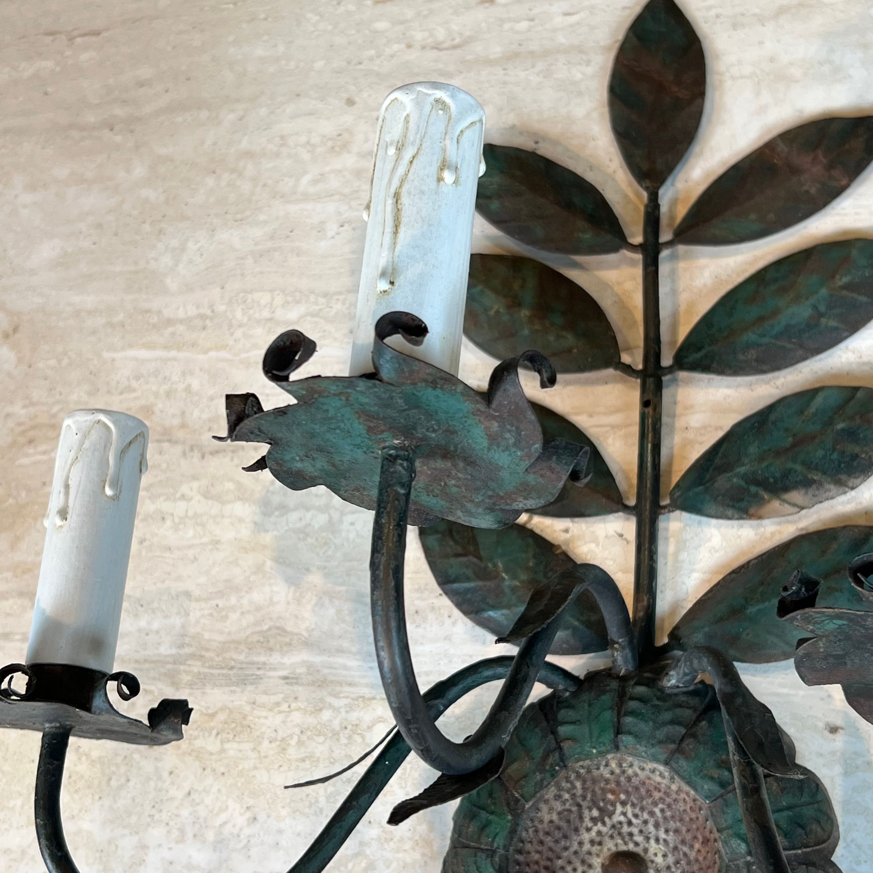 Pair of decorative wall sconces with sunflowers and patinated metal foliage.