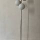 Cluster floor lamp with 3 spherical lamps in gold metal and white glass