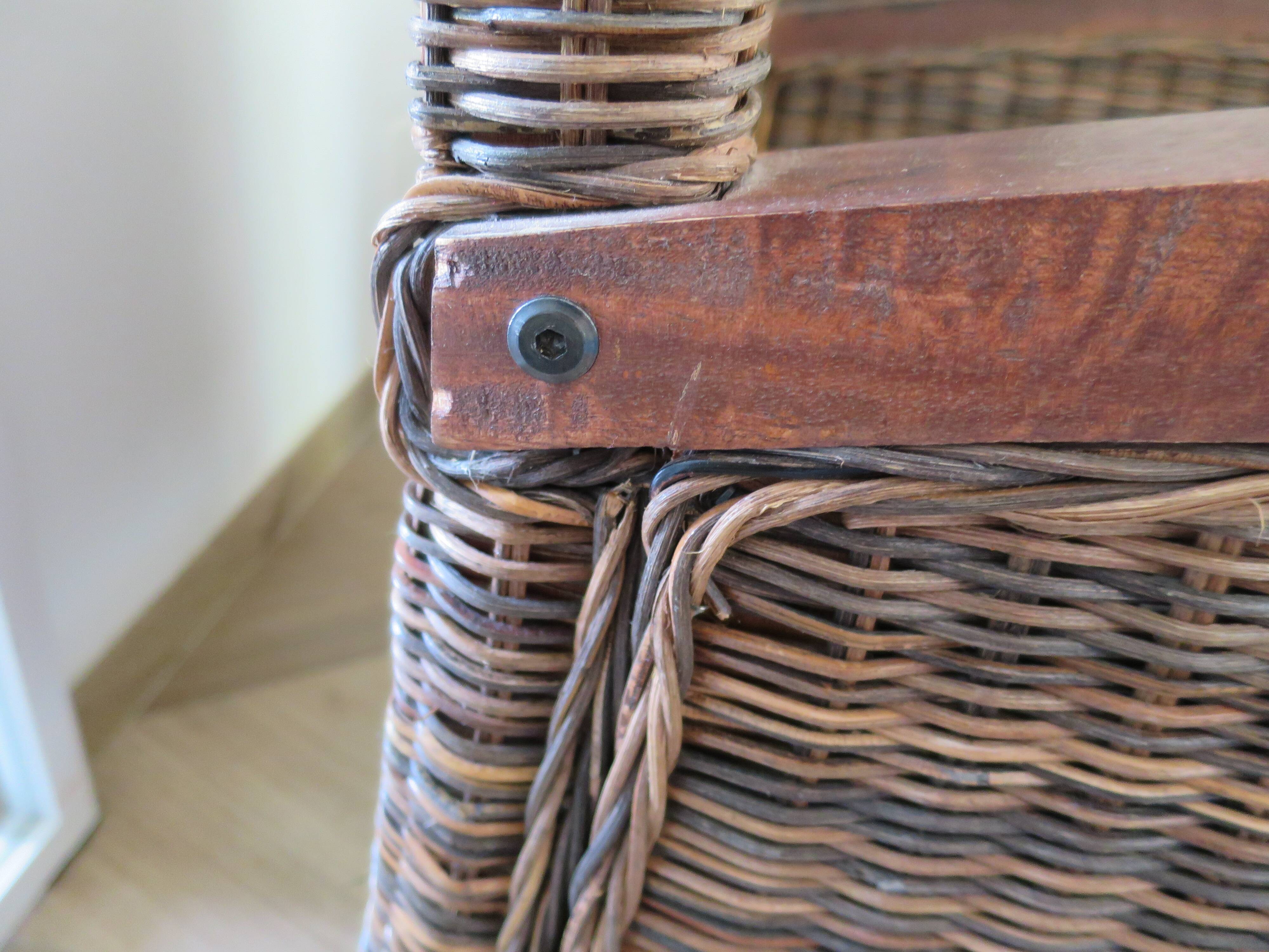 2 colonial-style armchairs in woven rattan and exotic wood