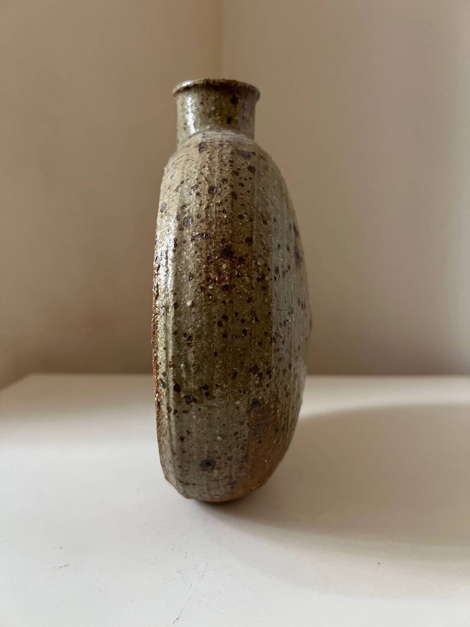 Vintage round, flat-bottomed stoneware bud vase