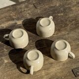 Set of 4 vintage speckled beige stoneware coffee cups.