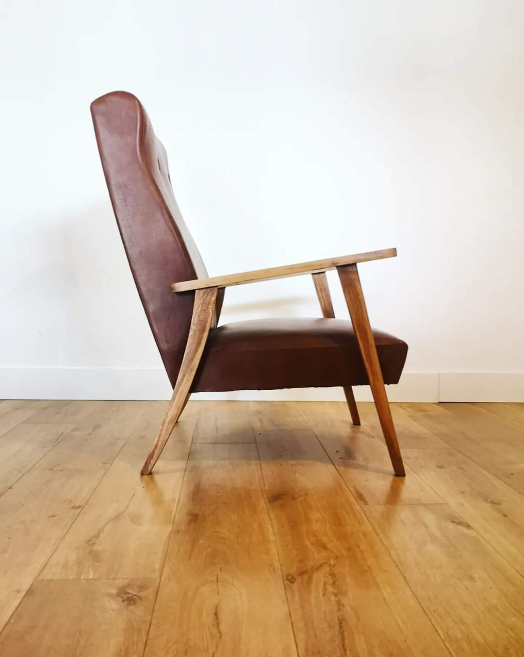 70 armchair in brown skai and wooden structure