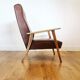 Fauteuil 70 en skaï marron et structure bois