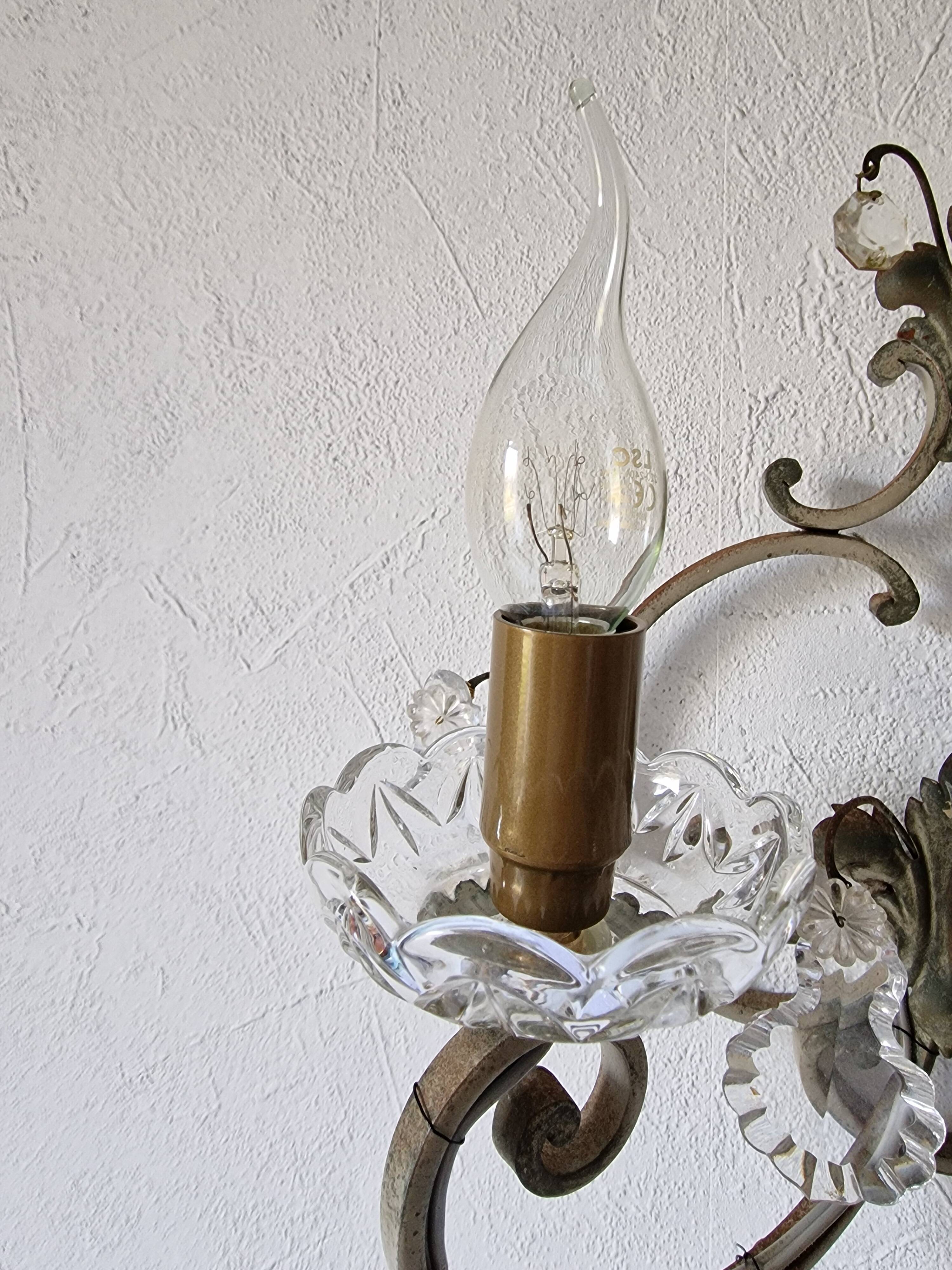 Pair of sconces in patinated metal and crystal tassels