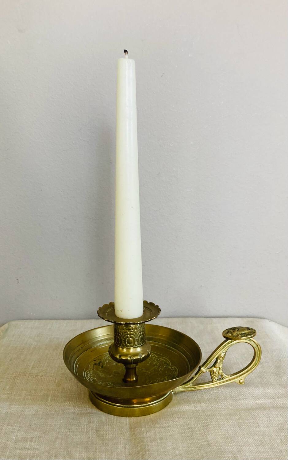 20th century chiseled brass socket candle holder representing Horsemen in armor