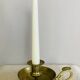 20th century chiseled brass socket candle holder representing Horsemen in armor