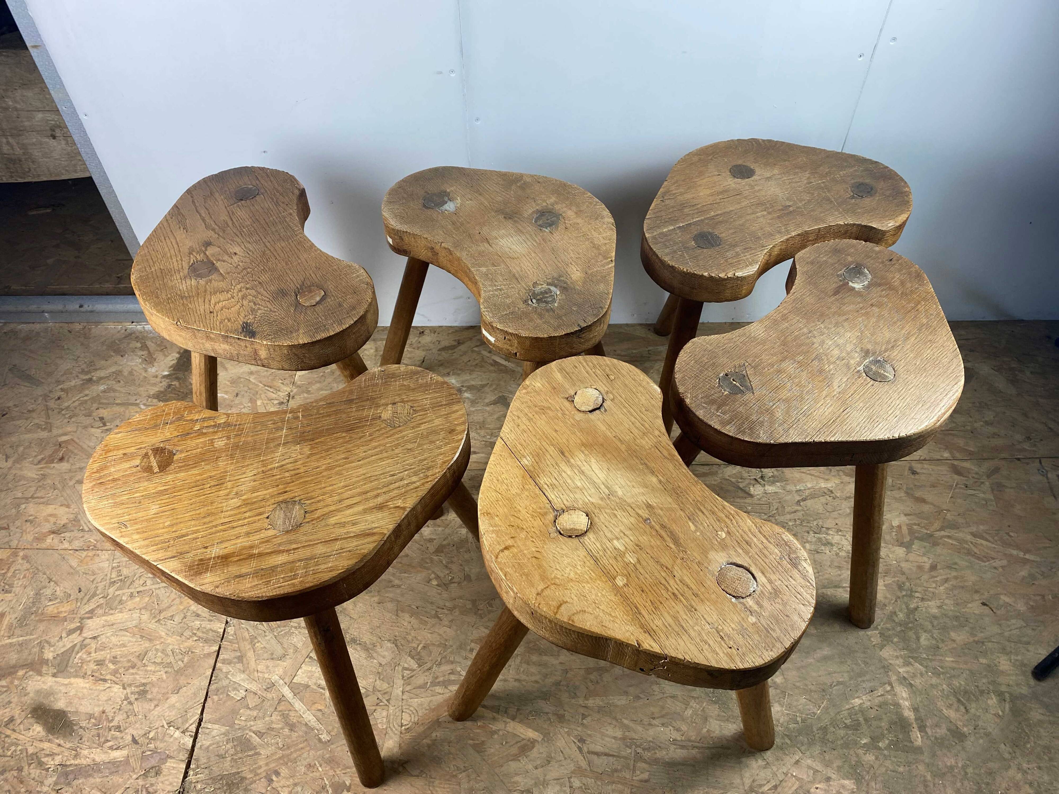 Set of 6 brutalist solid oak tripod farm stools from the 1950s
