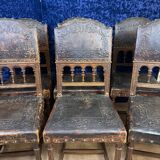 Set of 8 Renaissance style chairs in walnut and embossed leather