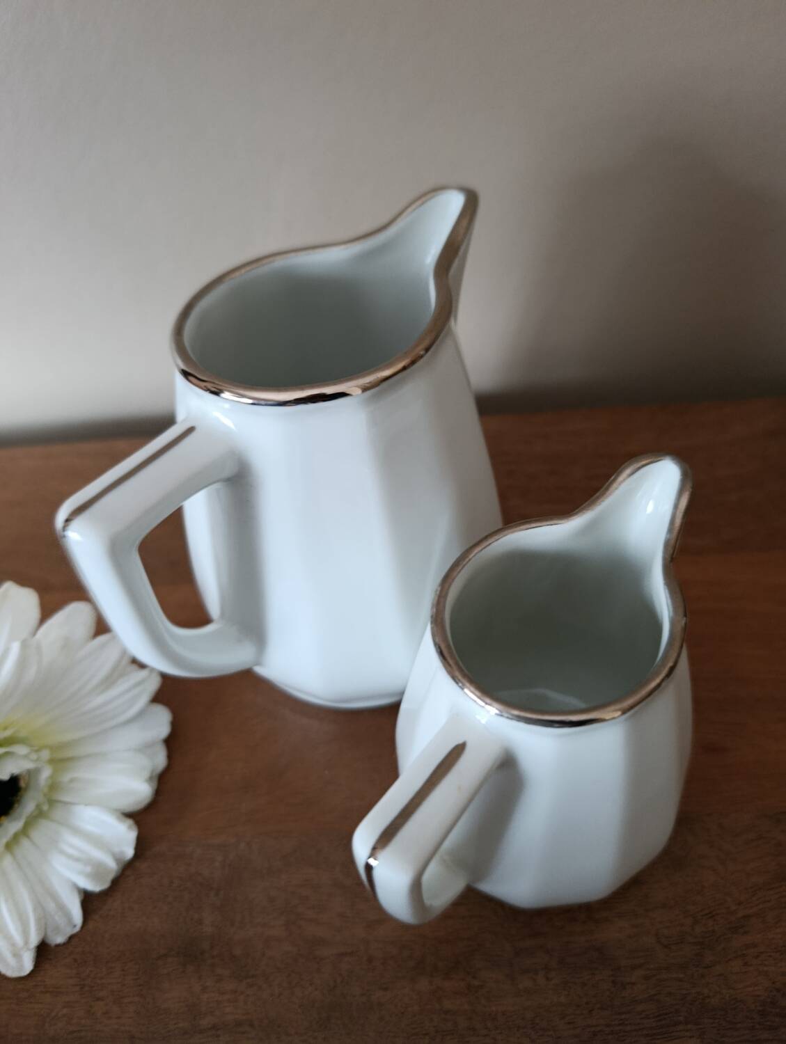 2 white porcelain milk jugs with platinum trim, Flora by Apilco.