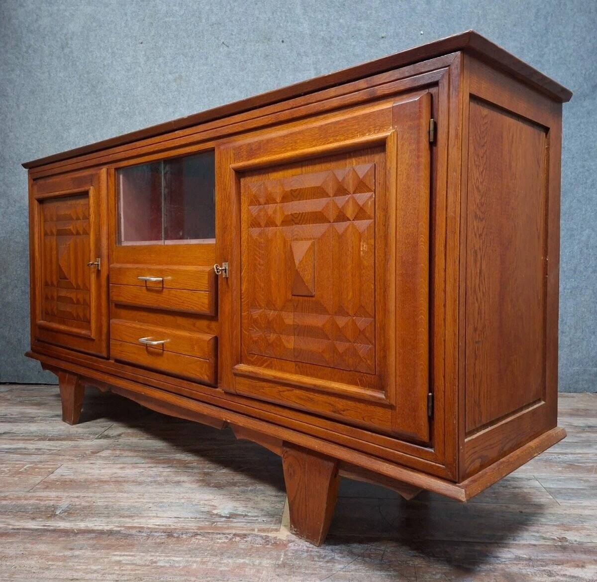 Low buffet in carved oak, Art Deco style, circa 1930.