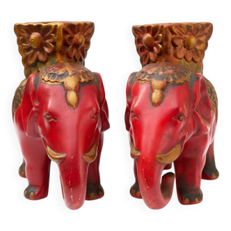 A pair of red and gold ceramic vases in the shape of elephants, 1940s.
