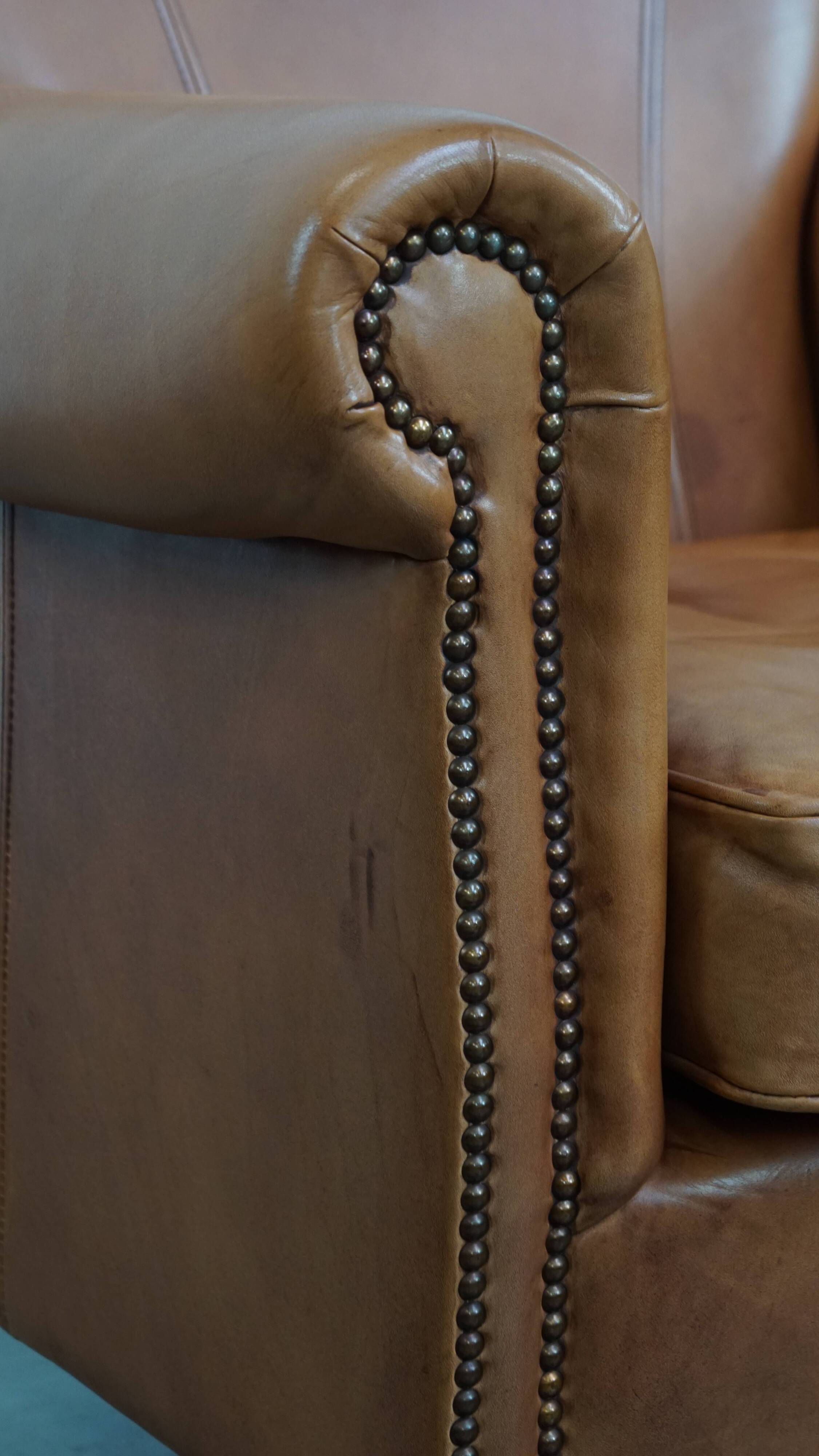 Cognac-colored cowhide leather armchair