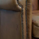 Cognac-colored cowhide leather armchair