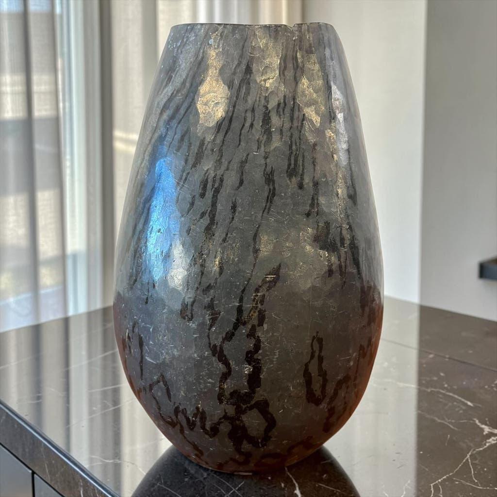 Vintage stone vase with worked fossil